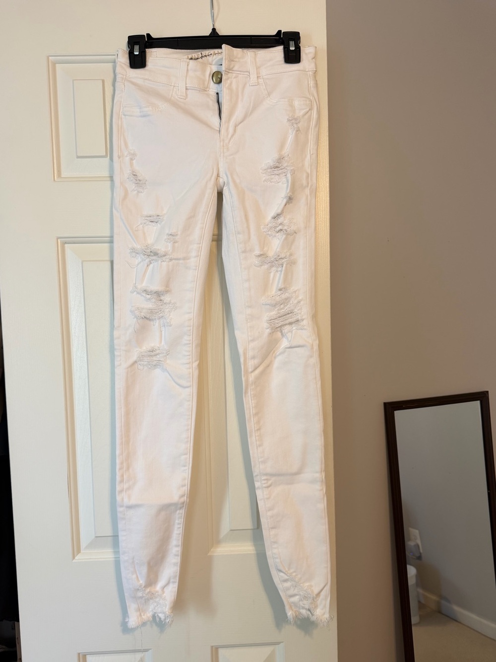 Next Level Stretch white ripped skinny jeans